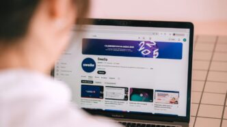 Person watching a youtube channel on a laptop