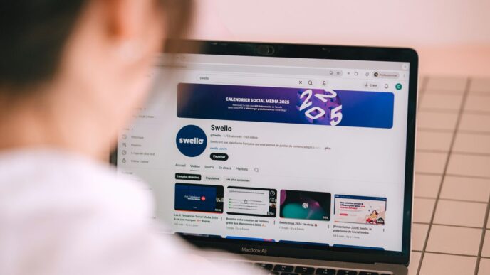 Person watching a youtube channel on a laptop