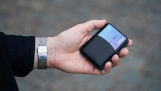 a person holding a cell phone in their hand