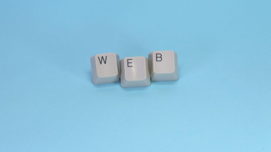 Keyboard keys spell out the word "web."