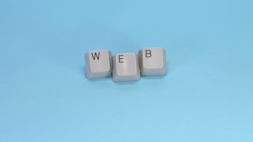 Keyboard keys spell out the word "web."