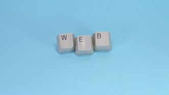 Keyboard keys spell out the word "web."