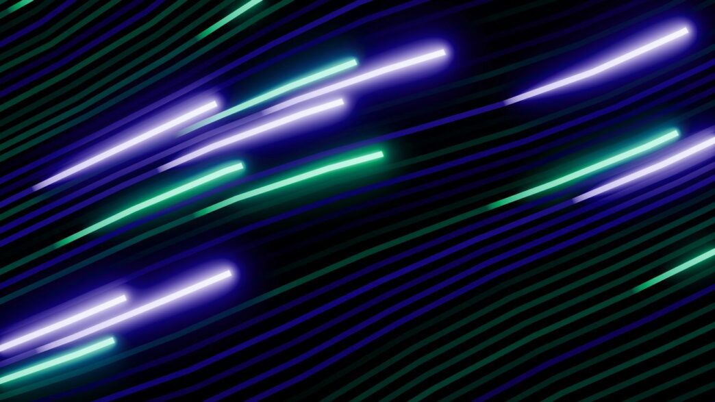 Abstract streaks of purple and green light