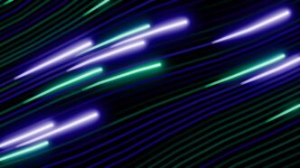Abstract streaks of purple and green light