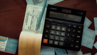 a calculator sitting on top of a wooden table