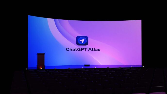 Large curved screen displays "chatgpt atlas" logo.
