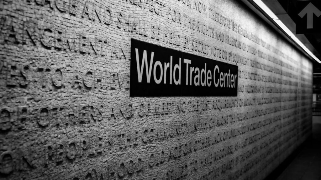 a black and white photo of a world trade center sign