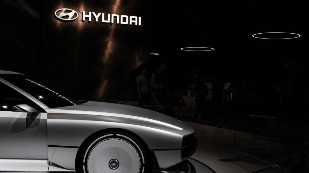 a white car parked in a showroom