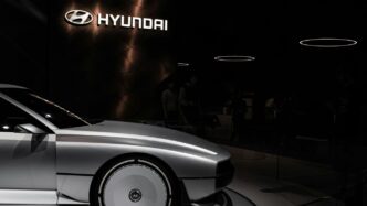 a white car parked in a showroom