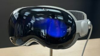 A pair of goggles sitting on top of a wooden table