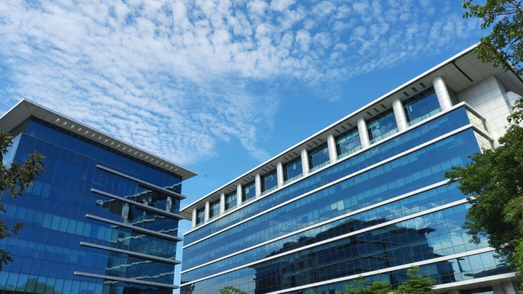 a building with a lot of windows and a sky background