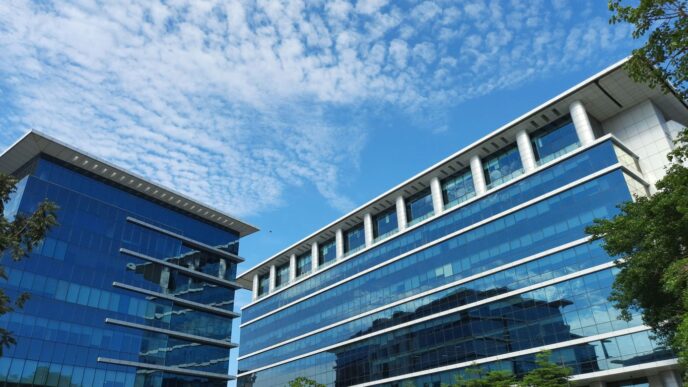 a building with a lot of windows and a sky background