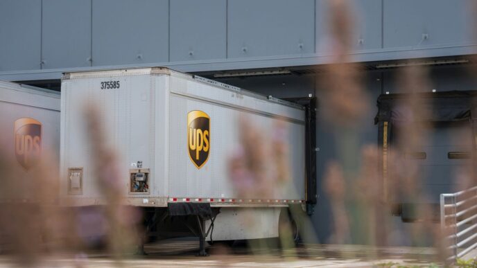 A truck is parked in front of a building