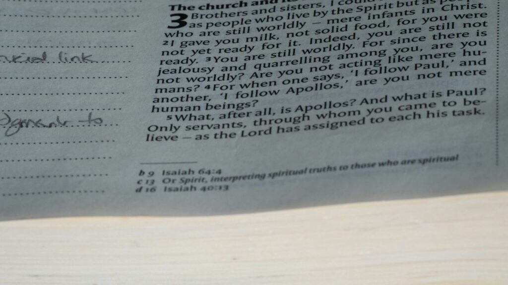 A close up of a newspaper with a clock on it