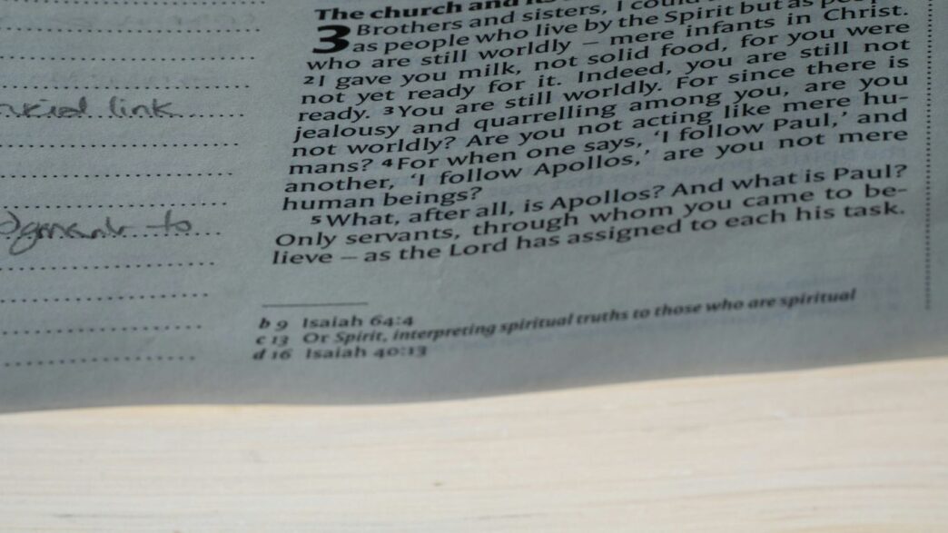 A close up of a newspaper with a clock on it