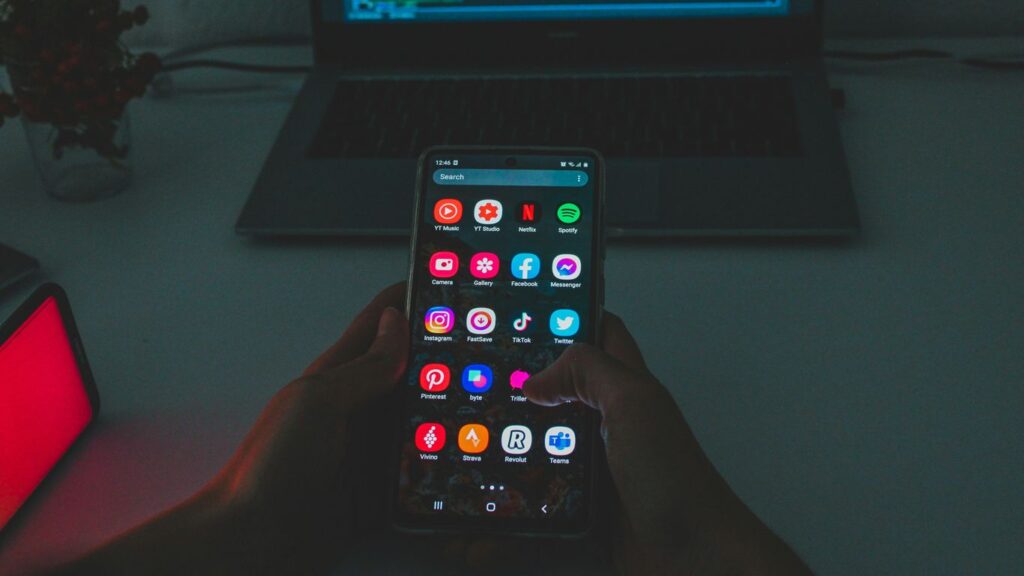 black android smartphone turned on displaying icons