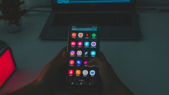 black android smartphone turned on displaying icons