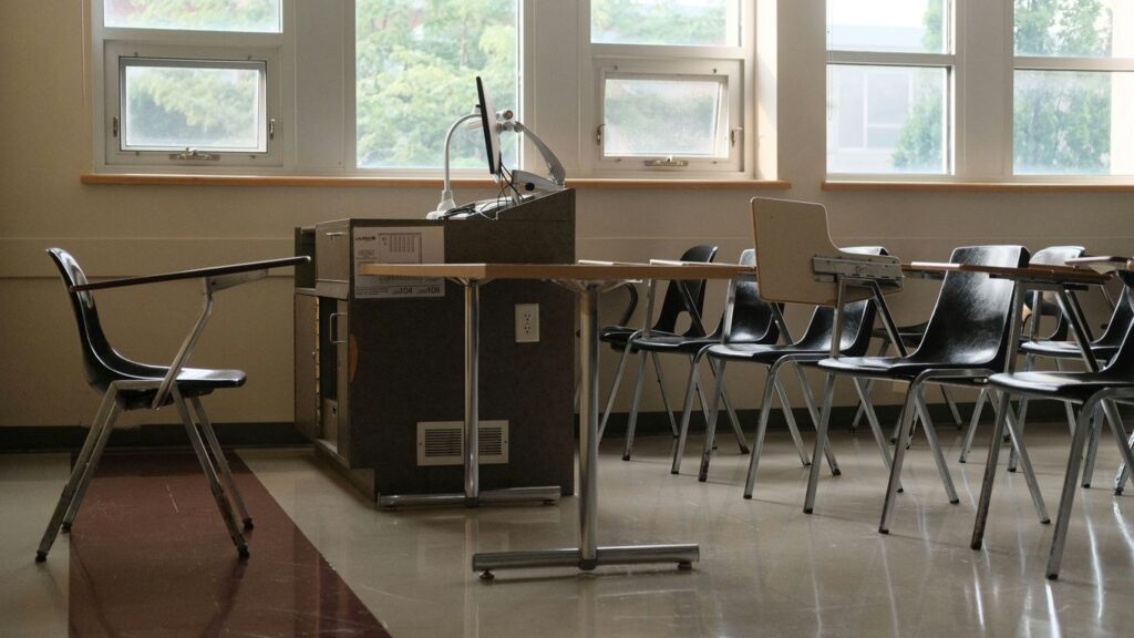 Empty classroom with desks and chairs