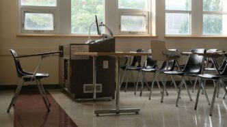 Empty classroom with desks and chairs