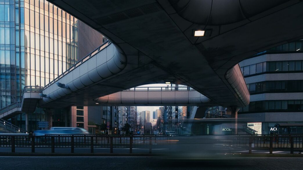 Modern city overpass with buildings and traffic below