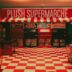 Plush supermarché storefront with checkered floor