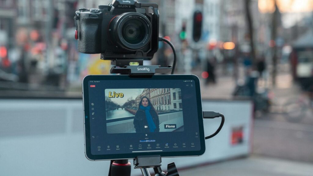 Camera and tablet on tripod filming city street