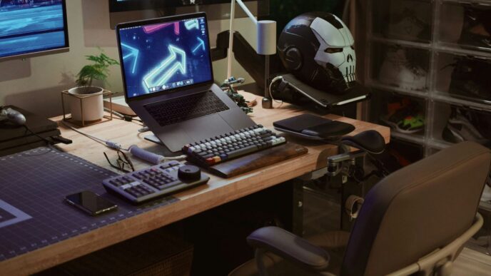 A computer desk with two monitors and a keyboard