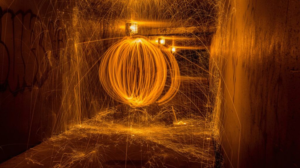 a large metal object is spinning in a tunnel