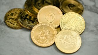 a pile of gold coins sitting on top of a table