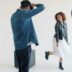 Photographer directs model during studio photoshoot