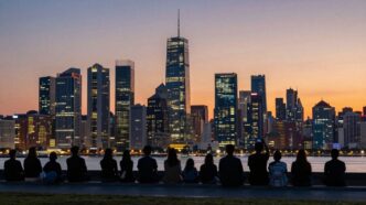 UK cityscape at dusk with silhouettes of people looking forward.