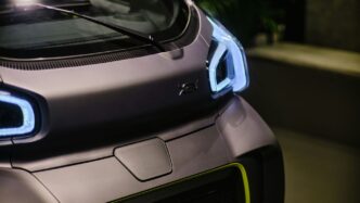 a close up of a car with its lights on