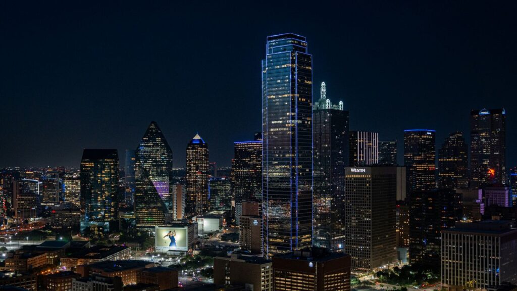 A view of a city at night from the top of a building