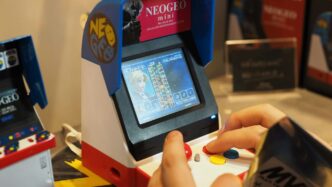 a person playing a game with a nintendo wii controller