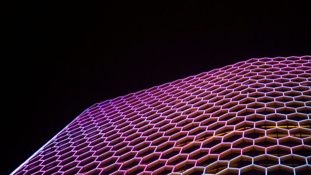 a very tall building with a lot of hexagonal shapes on it