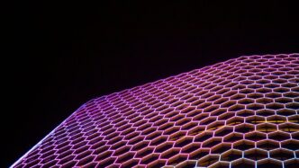 a very tall building with a lot of hexagonal shapes on it