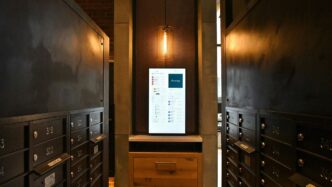 brown wooden cabinet with white printer paper