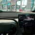 a car dashboard with a laptop on it
