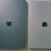 two silver ipads side by side on a wooden surface