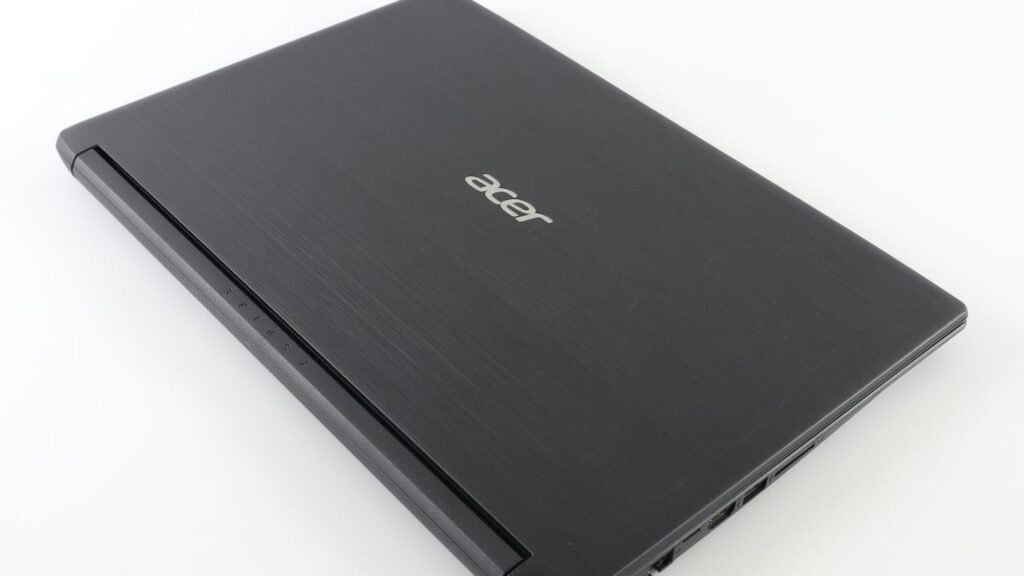 a laptop computer sitting on top of a white table