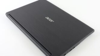 a laptop computer sitting on top of a white table