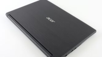 a laptop computer sitting on top of a white table