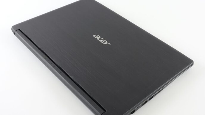 a laptop computer sitting on top of a white table