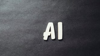 the word ai spelled in white letters on a black surface