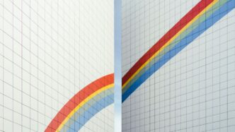 a couple of white walls with a rainbow painted on them