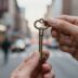 Hands holding a key, unlocking secrets.