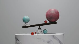 a sculpture with balls on top of it