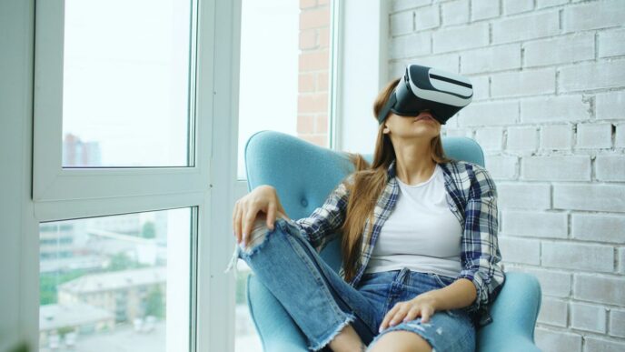 Woman wearing vr headset sitting in armchair