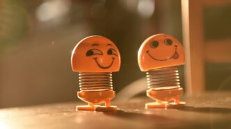 two orange and white plastic toys