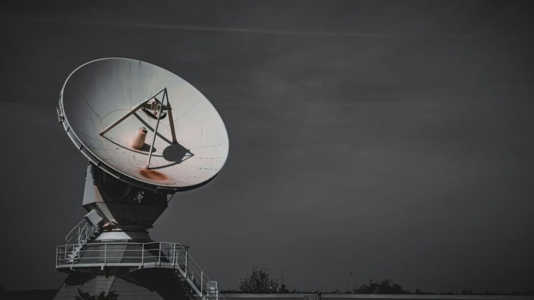 a large satellite dish sitting on top of a metal platform